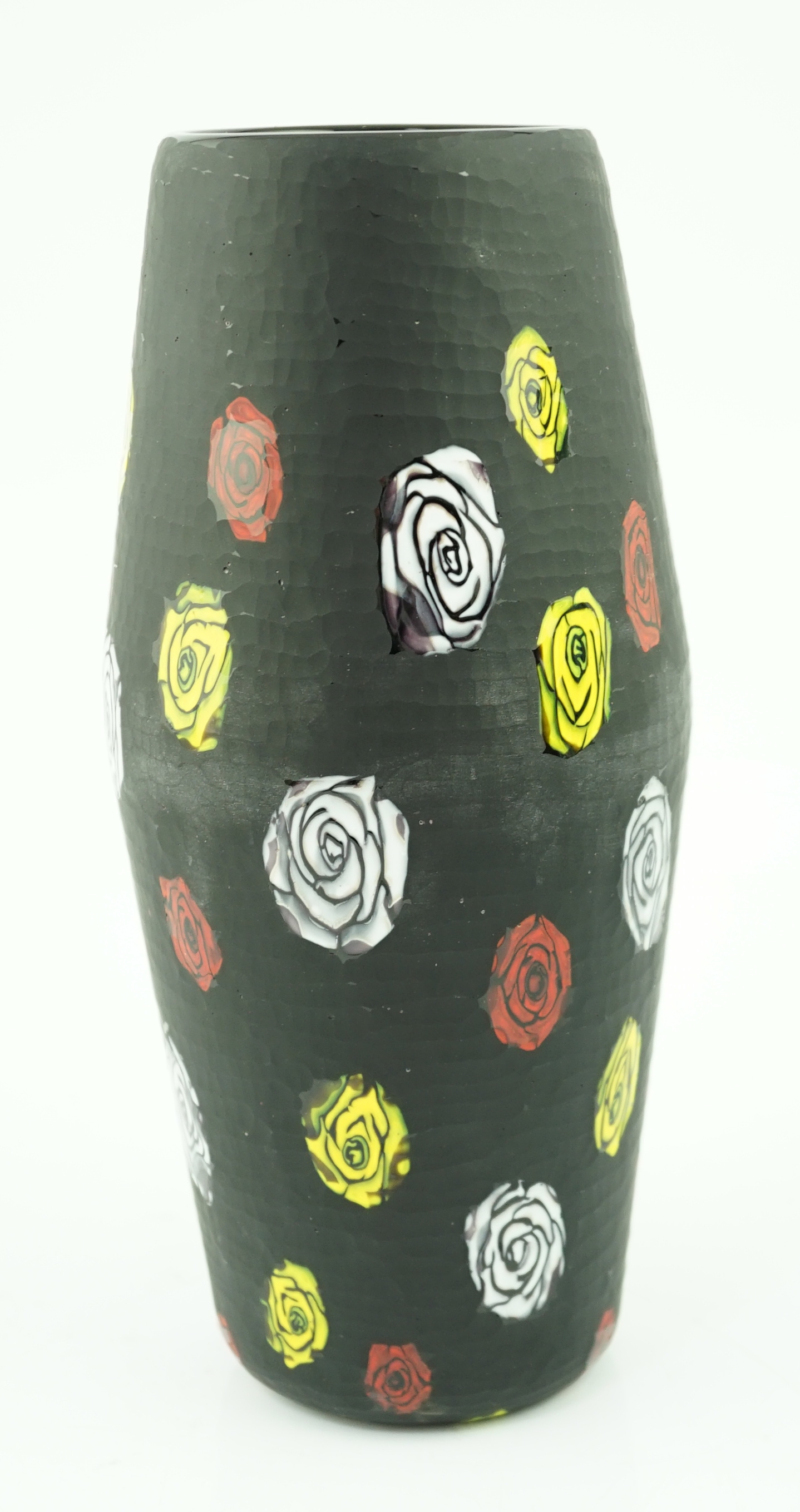 Vittorio Ferro (1932-2012) A Murano glass Murrine vase, the black ground with white, red and yellow flower heads, unsigned, 28cm., Please note this lot attracts an additional import tax of 20% on the hammer price